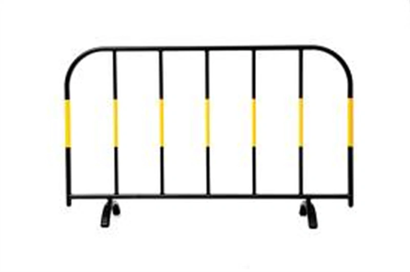 Black metal temporary crowd control barrier with yellow horizontal visibility stripes and wheels, manufactured by DB Fencing a B2B wire mesh fence supplier offering durable, portable barriers for construction firms, event management companies, and global distributors.