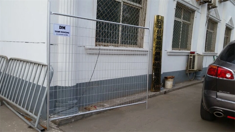 DB Fencing's temporary wire mesh fence with proprietary plastic feet installed at their Anping County factory, showcasing durable, AS4687-compliant fencing solutions for construction and event management clients.