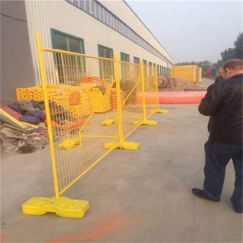 Yellow temporary fence with heavy-duty plastic feet produced by DB Fencing, a leading wire mesh fence manufacturer in Anping, China, ideal for construction site security and event crowd control applications.