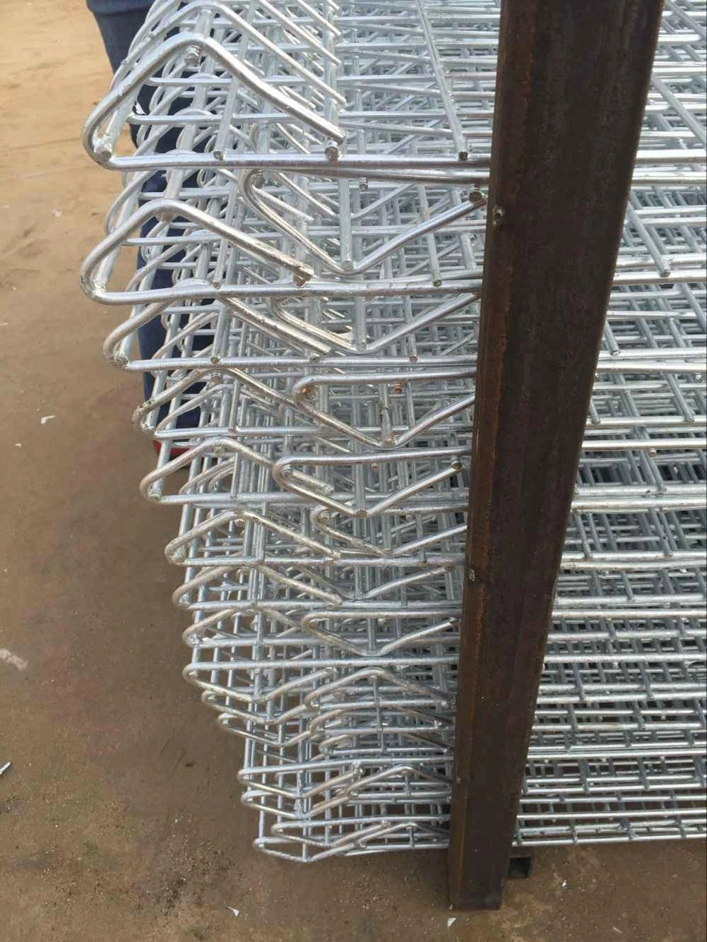 Stack of galvanized BRC fence panels, a core product of DB Fencing, a leading wire mesh manufacturer in Anping, China, offering durable, AS4687-compliant fencing solutions for construction, events, and agriculture.