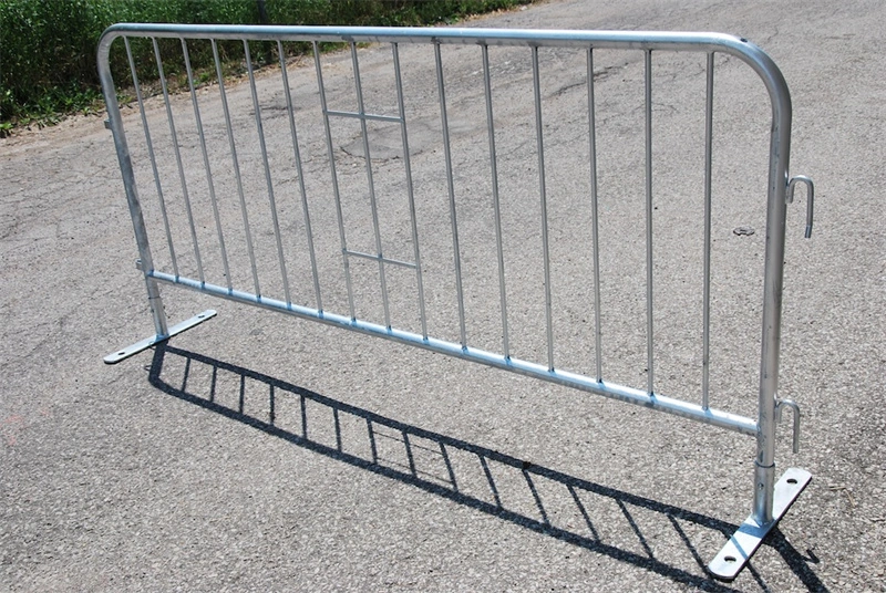 A galvanized metal crowd control barrier from DB Fencing, featuring a hot-dipped finish for outdoor durability, designed for temporary site security and crowd control at events.