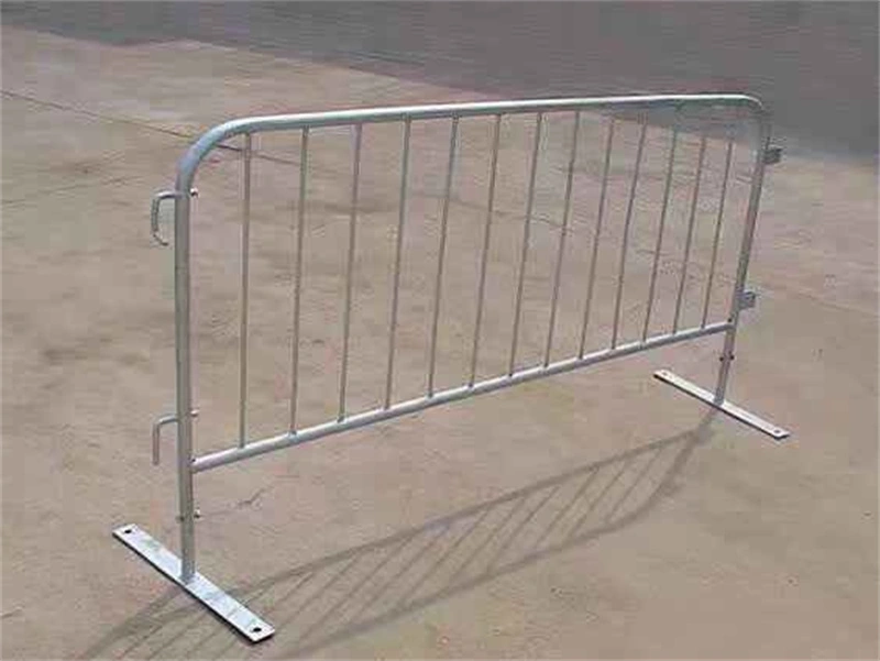 Galvanized steel crowd control barrier with hot-dipped finish, featuring sturdy metal feet and side handles, designed for temporary site security and crowd management by DB Fencing, a leading wire mesh manufacturer with 14 years of export experience and compliance with Australian Standards AS 4687-2022.