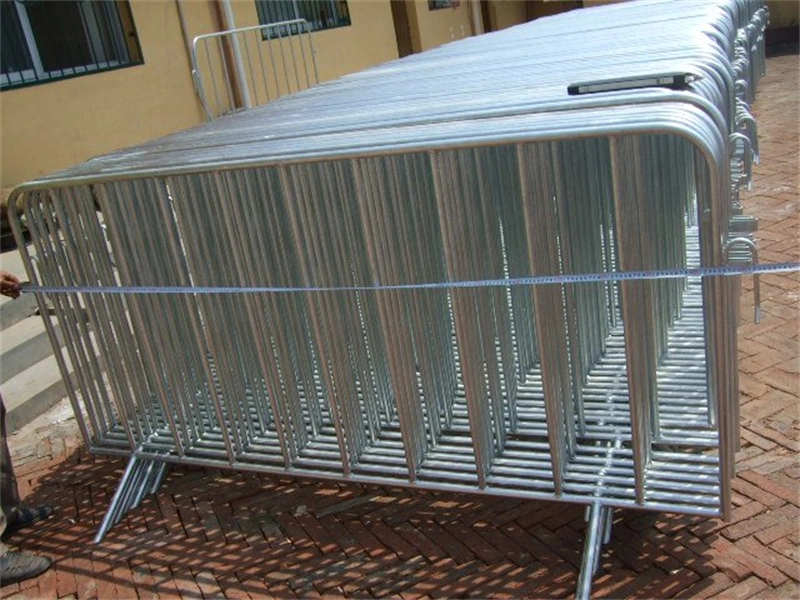 Stacked galvanized steel crowd control barriers from DB Fencing, a leading wire mesh manufacturer, ideal for event management and construction firms needing durable temporary fencing with hot-dipped galvanized finish.