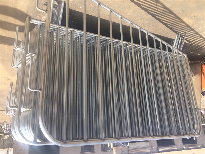 Stack of galvanized steel crowd control barriers from DB Fencing, a leading Anping-based wire mesh manufacturer, designed for temporary site security, event crowd control, and agricultural livestock fencing.