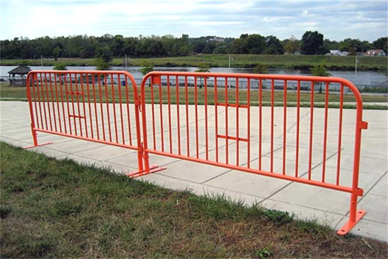 Bright orange temporary crowd control barriers with durable plastic feet, manufactured by DB Fencinga leading wire mesh fence supplierdesigned for event management and construction site security, featuring hot-dipped galvanized finishes for outdoor durability.