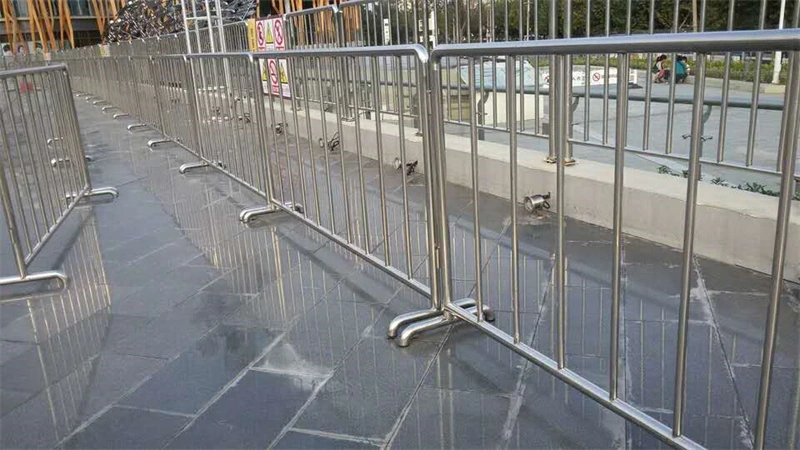 Stainless steel crowd control barriers with durable plastic feet, manufactured by DB Fencinga leading wire mesh fence exporter with 14 years of experience, providing AS4687-compliant temporary security solutions for events and construction projects.