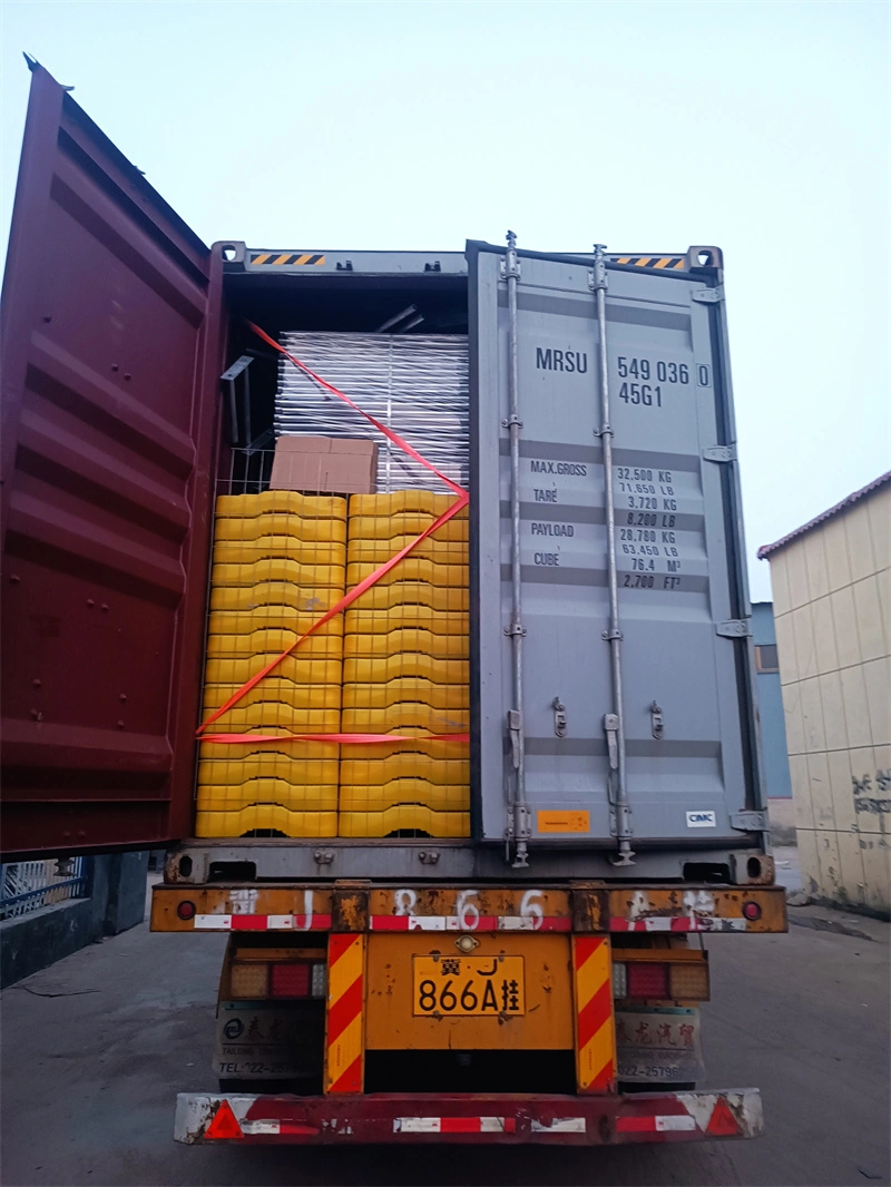 DB Fencing's yellow plastic fence feet, a critical component of their temporary fencing solutions, are securely stacked and strapped in a 20ft shipping containershowcasing the company's one-stop manufacturing and bulk export capabilities for construction firms, event organizers, and global distributors.
