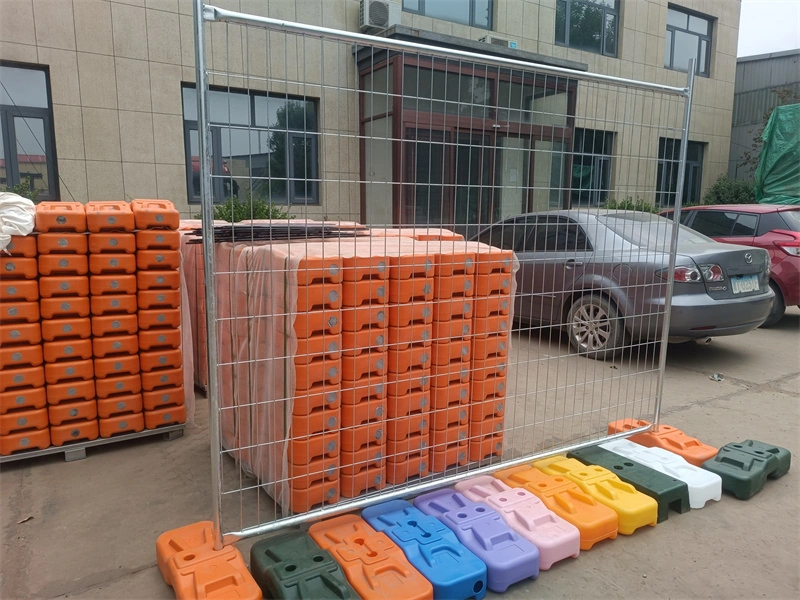 Temporary wire mesh fence with colorful plastic feet (manufactured in-house) by DB Fencing, a leading one-stop wire mesh fence supplier with ISO9001/SGS certification, serving construction, event management, and agricultural clients in Australia, New Zealand, and beyond.