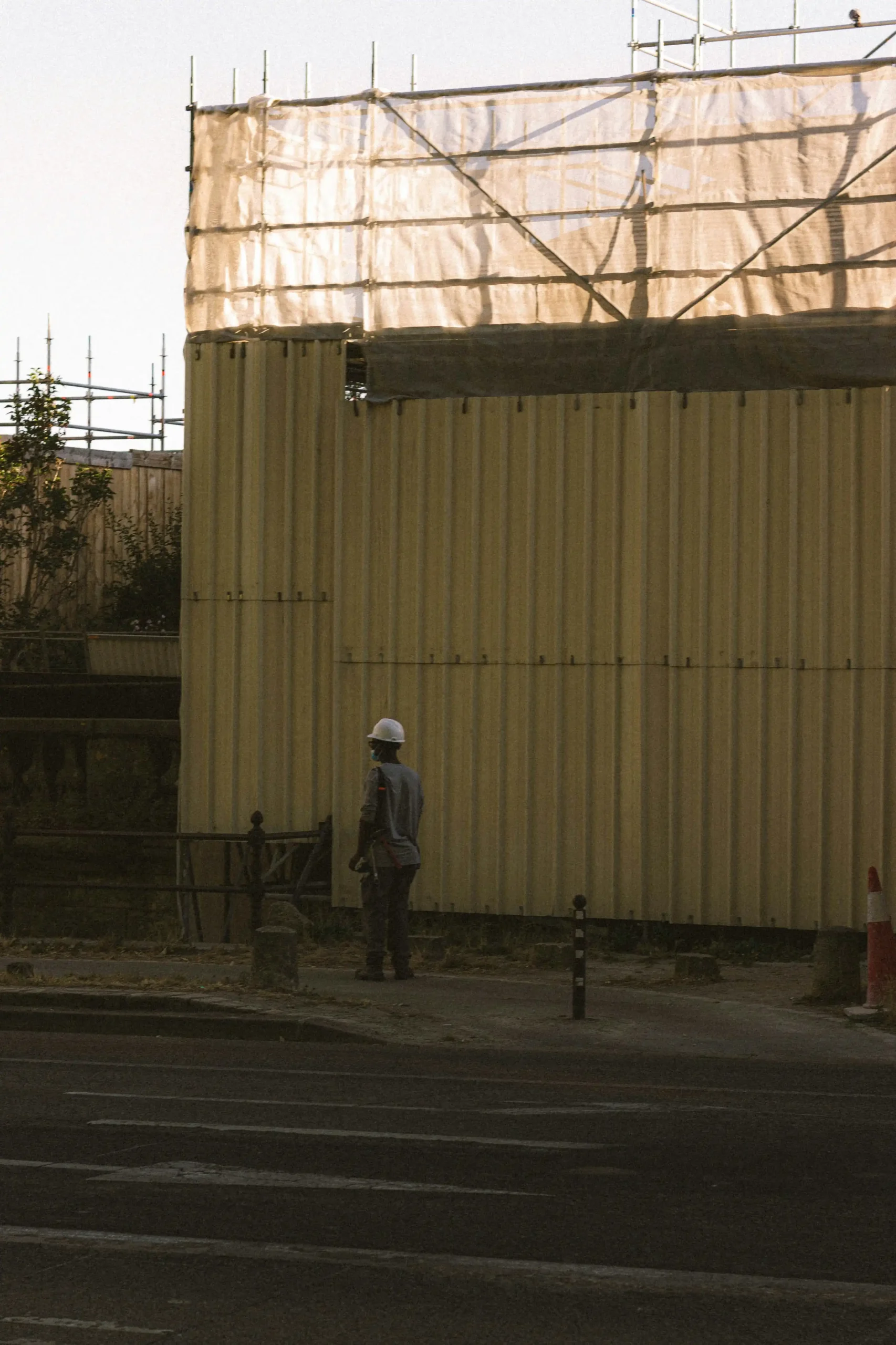 inspector checking temporary fence panel