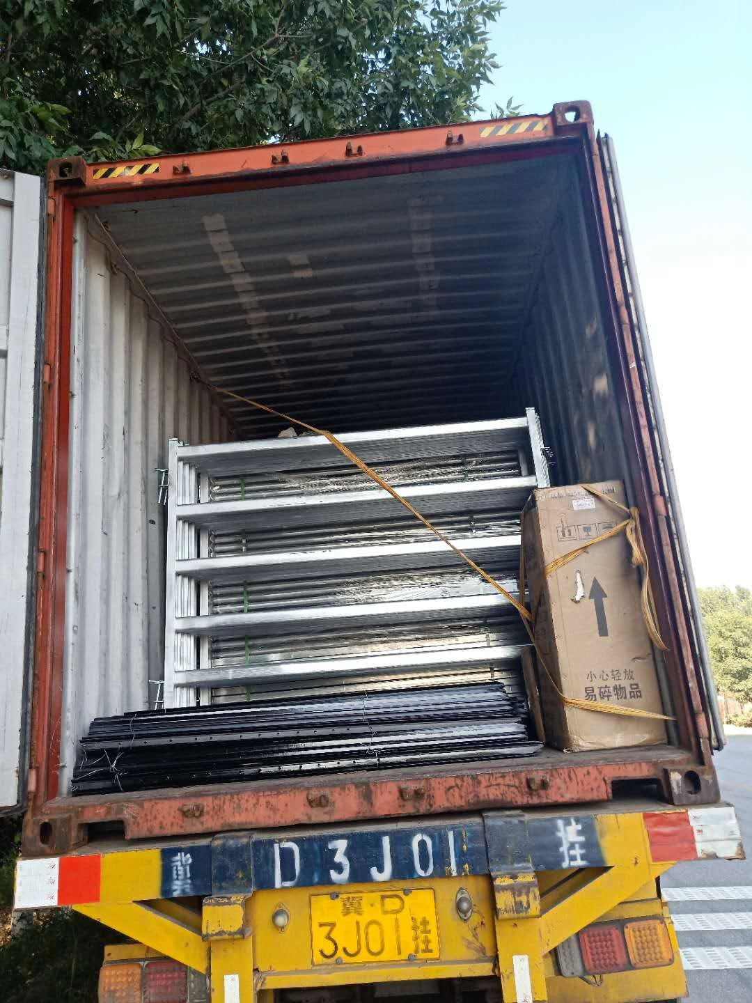 A 40-foot container fully loaded with galvanized cattle panels and livestock corral panels. DB Fencing manages high-volume export logistics for Australian-standard temporary and permanent fencing solutions.