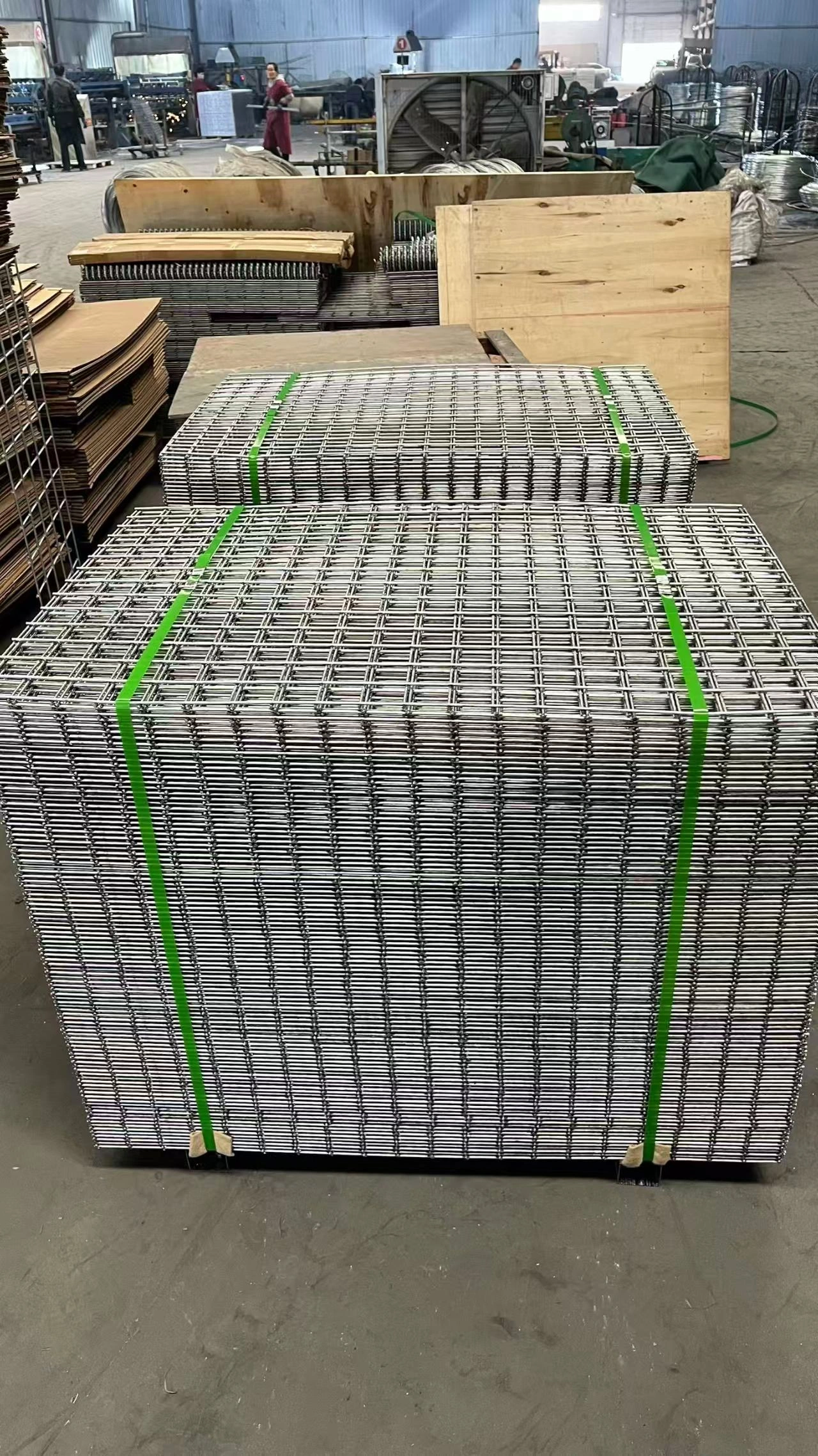 Stacks of galvanized Hesco barrier wire mesh panels packaged and ready for export from DB Fencing's Anping production facility.