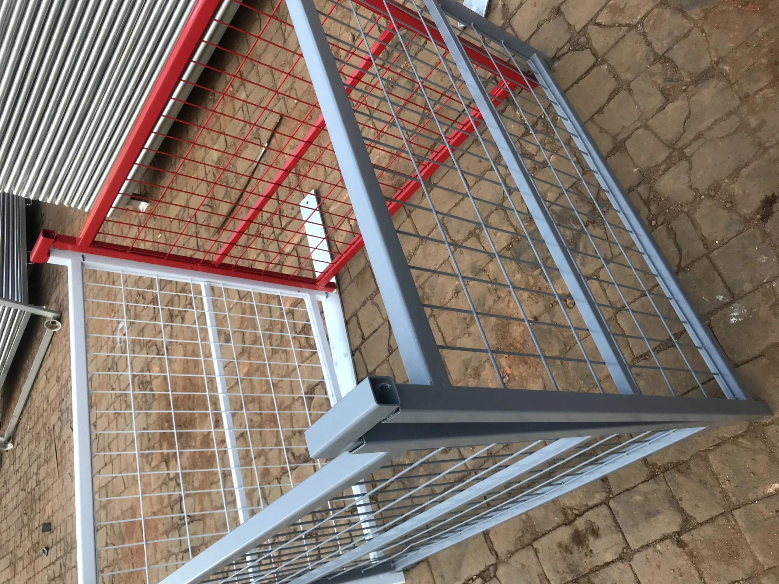 Heavy-duty powder-coated mesh panels for temporary fencing systems for construction sites, manufactured by DB Fencing to meet Canadian and international compliance standards.