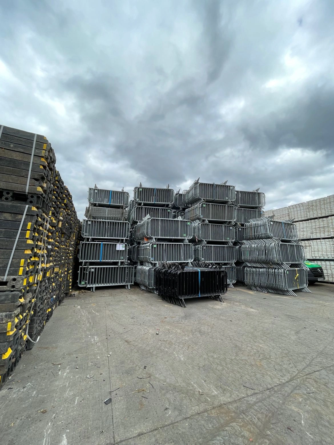 A vast inventory of Anping Deban Metal Wire Mesh Products Co., Ltd's (DB Fencing) hot-dipped galvanized crowd control barriers stacked in our storage yard, ready for global distribution. These high-capacity temporary fencing solutions, designed for events and public safety, demonstrate our manufacturing strength and compliance with Australian Standards, catering to event management companies and distributors worldwide.