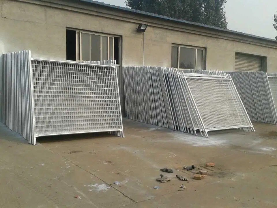 Bulk stacks of hot-dipped galvanized temporary fencing systems for construction sites, manufactured by Anping Deban Metal Wire Mesh Products Co., Ltd (DB Fencing), are shown ready for export from our Anping factory. These robust, compliant mesh panels demonstrate DB Fencing's large-scale production capacity, ideal for B2B distributors and construction firms in Australia, New Zealand, and global markets seeking reliable temporary site security solutions.