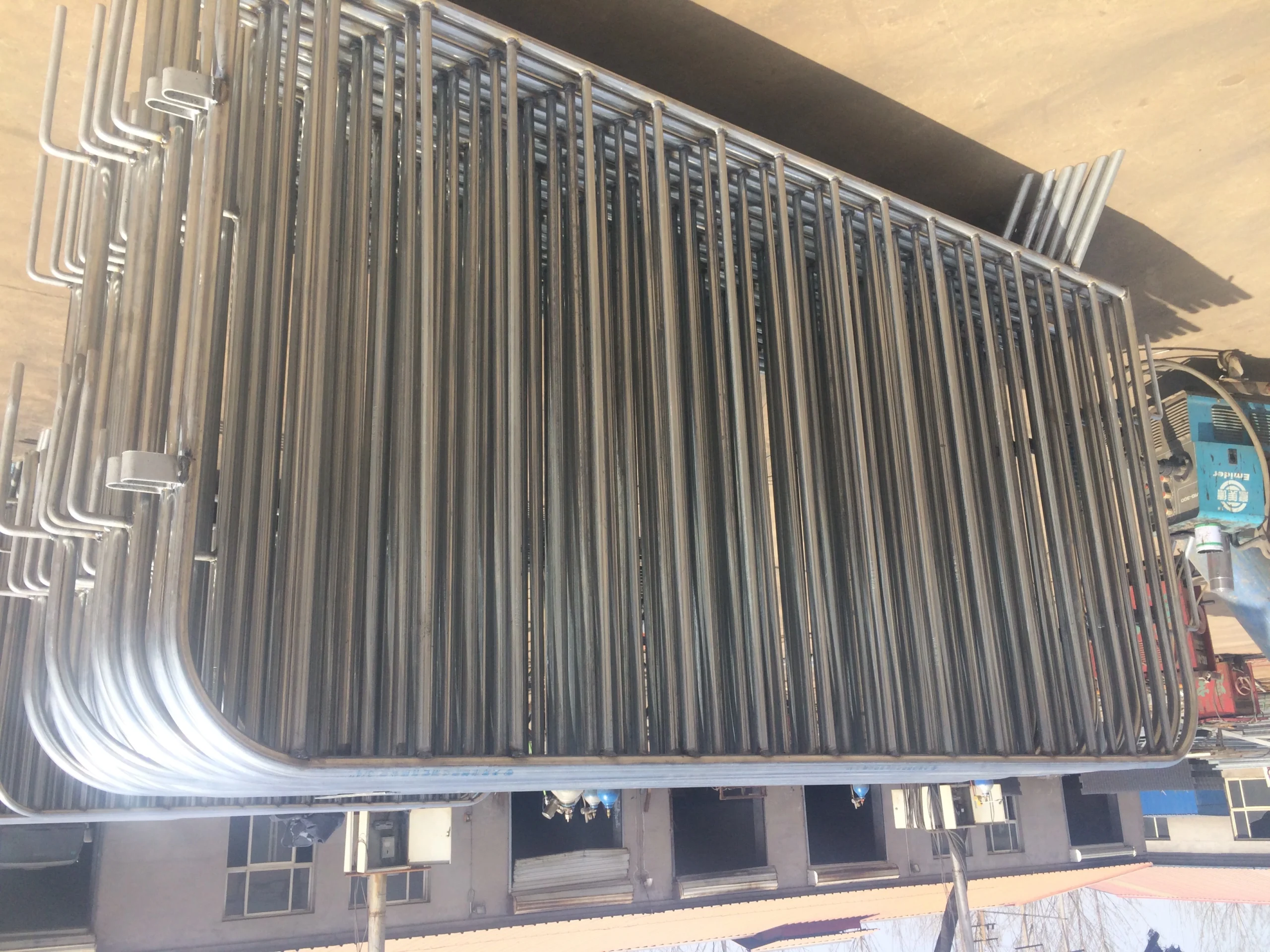 Stacks of premium hot-dipped galvanized steel crowd control barriers from Anping Deban Metal Wire Mesh Products Co., Ltd (DB Fencing), showcased in our manufacturing facility. These robust and durable crowd control barriers are engineered to meet strict international standards, ensuring reliable event perimeter management and public safety for our global clients, including those in Australia, New Zealand, and North America.