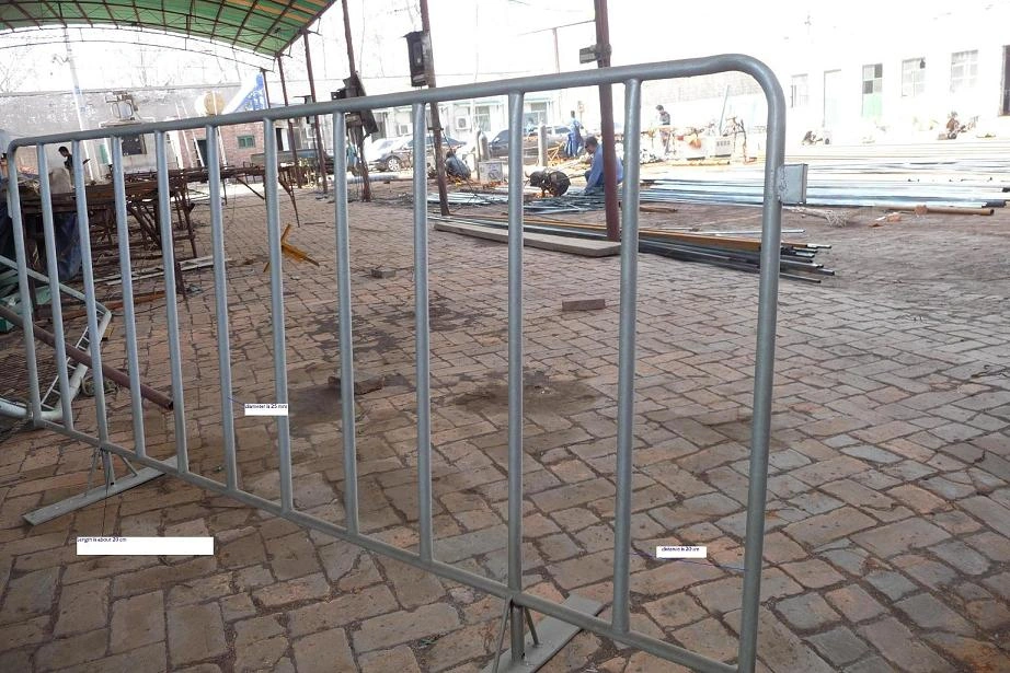 A robust, hot-dipped galvanized steel crowd control barrier from DB Fencing stands in an active industrial yard, demonstrating our durable products. This AS 4687 compliant barrier is ideal for securing construction sites or managing crowds at events, reflecting DB Fencing's quality manufacturing.