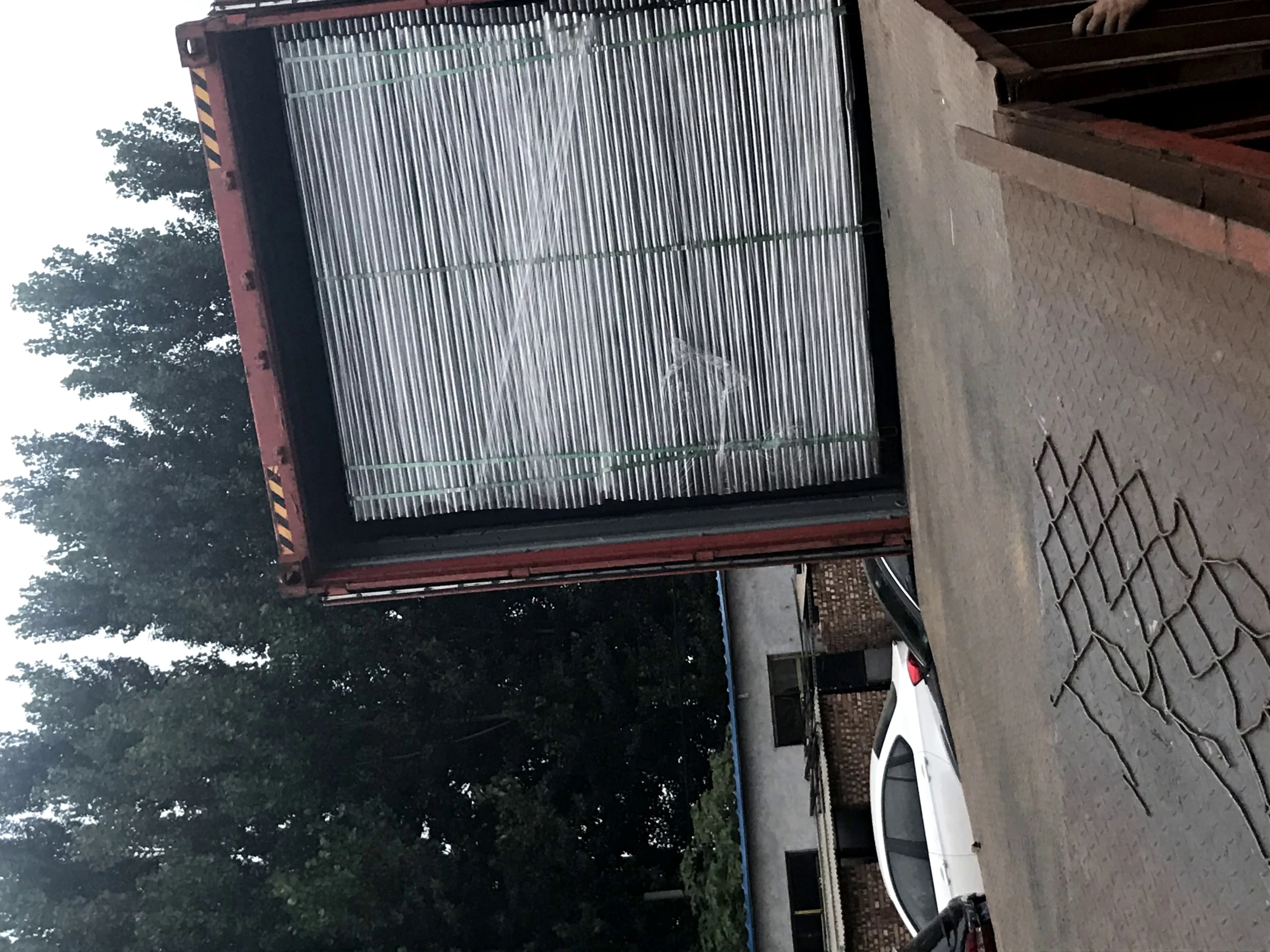 A shipping container from Anping Deban Metal Wire Mesh Products Co., Ltd (DB Fencing) is efficiently loaded with durable galvanized components for temporary fencing systems for construction sites. These bulk-packed metal tubes, essential for panel frames, are secured and prepared for global export, demonstrating our 'one-stop' manufacturing and supply chain capabilities from Anping, China.
