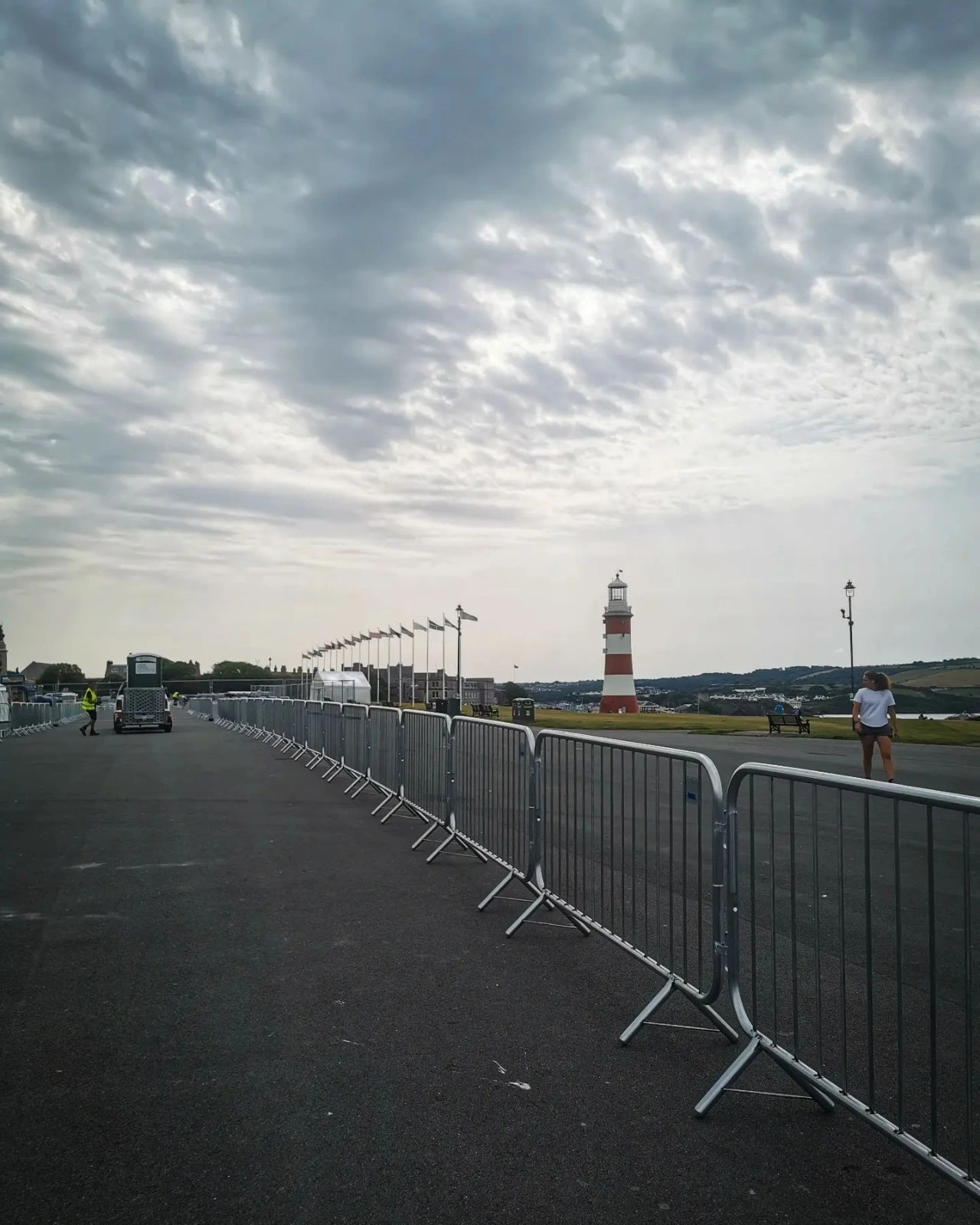 A long array of DB Fencing's robust, hot-dipped galvanized steel crowd control barriers provides essential perimeter management for events and public safety at an outdoor waterfront location. These temporary barriers, designed to meet Australian Standard AS 4687-2022/2007, offer superior durability for event management companies and public gatherings.