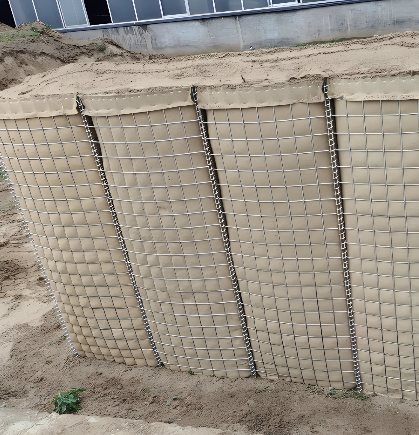 Anping Deban's galvanized steel Hesco barriers featuring reinforced wire mesh for robust site retaining walls. This temporary fencing system meets strict Australian engineering standards for civil construction security.