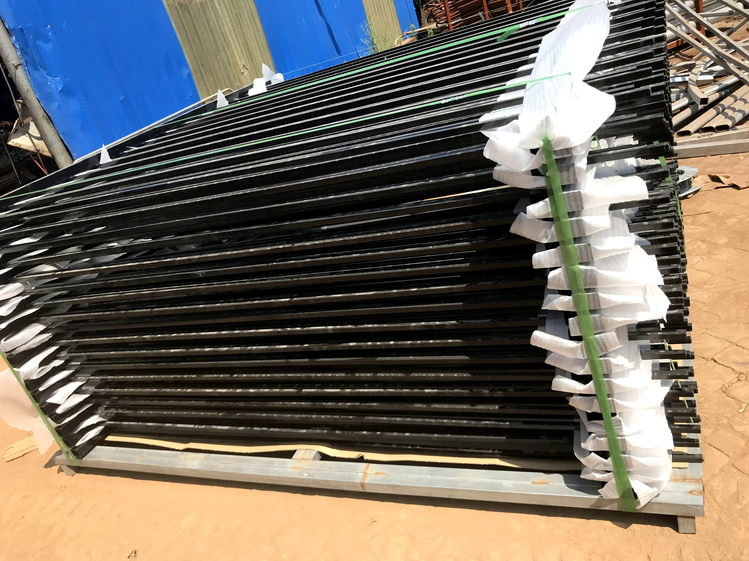Factory output of galvanized steel picket fence panels packaged for export from DB Fencing in Anping. This temporary fencing system ensures maximum security for construction sites and permanent perimeter applications.