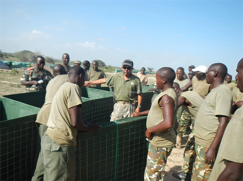 A team inspects robust Hesco barriers manufactured by DB Fencing, showcasing the durability of our wire mesh products designed for military applications and crowd control scenarios.