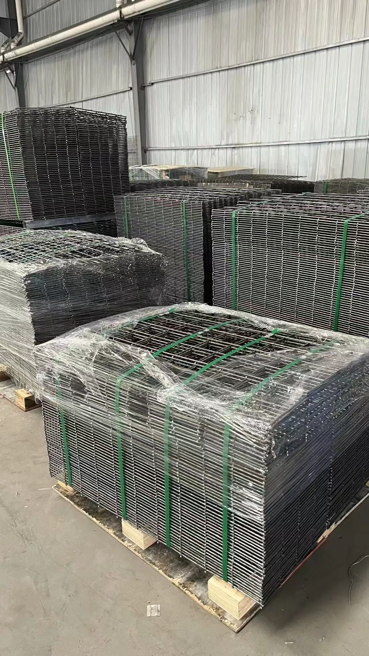 Factory-direct stock of hot-dipped galvanized Hesco barrier panels ready for immediate export, showcasing DB Fencing's production capacity.